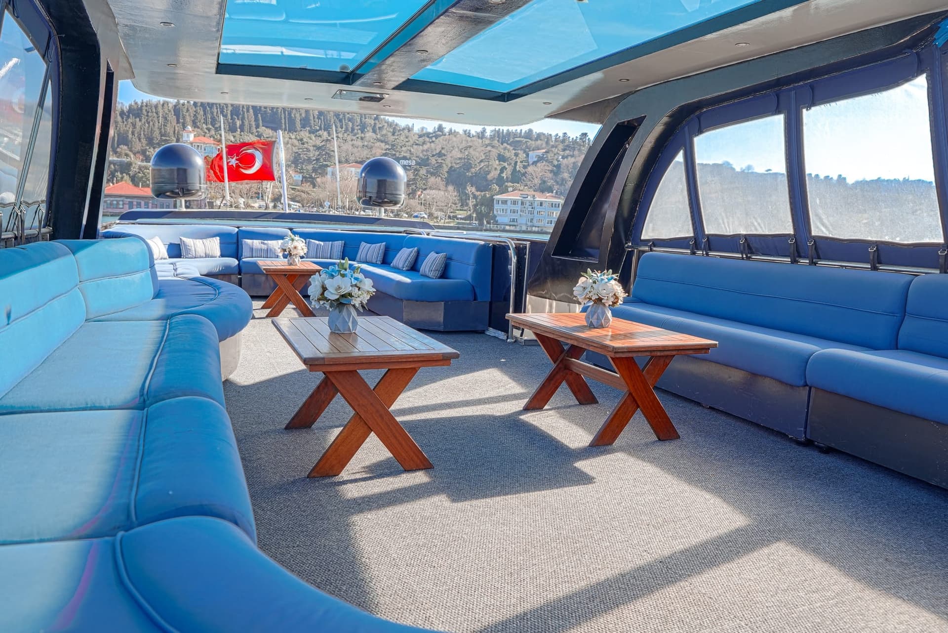 The private upper deck of a Vesper yacht set for two on the Bosphorus