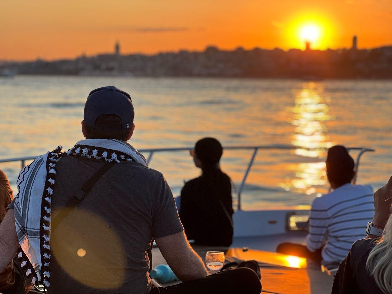 The Bosphorus glowing amber at golden hour from a Vesper sunset sail, Istanbul